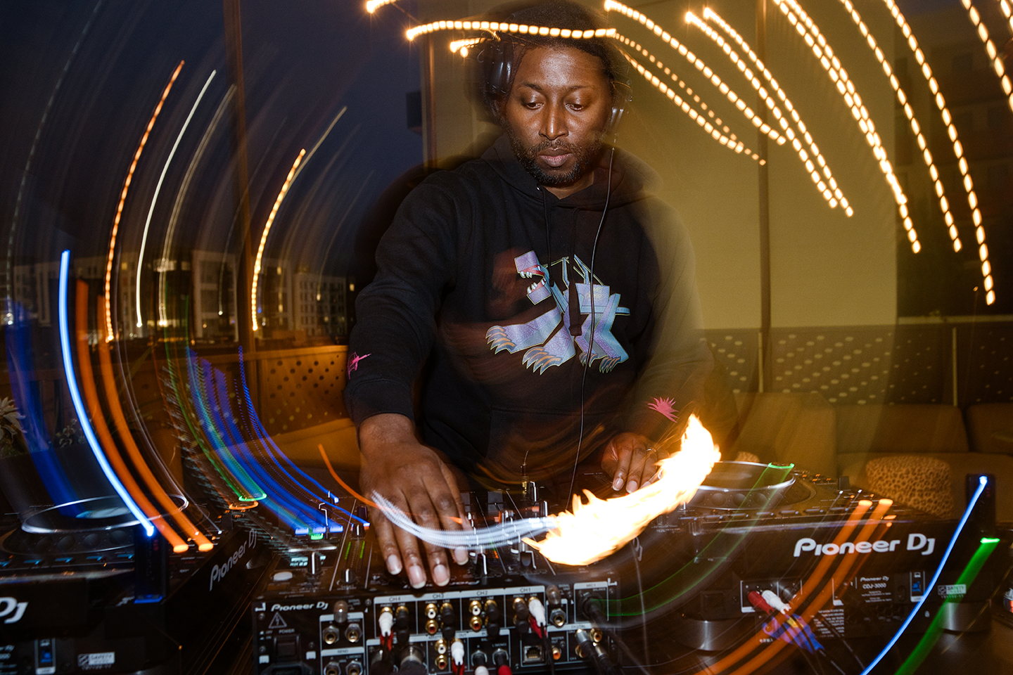 DJ Cecil behind the decks at High 5ive Rooftop Bar
